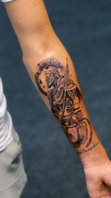 250+ Spartan Tattoos Designs and Ideas (2023) - TattoosBoyGirl Cristian Tattoo For Men, Roman Forearm Tattoo, Roman Gladiator Tattoo Design, Simple Forearm Tattoo Men, Spartan Tattoo Design, Roman Tattoos, Spartan Tattoos, Spartan Helmet Tattoo, Ancient Greek Design