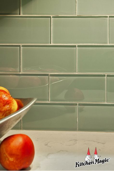 Glass Subway Backsplash Most homeowners are taking the backsplash all the way to the ceiling. It’s a great way to add some drama to the overall kitchen motif. For a pop of color and a little glam, glass in subway style is extremely trendy right now. Choose blue or green for a focal point to the overall design. Or use your favorite color to sprinkle in a little of your own personality. #subwaytile #glasstile #glasstiles #backsplash #backsplashglass #glasssubway #kitchendesign #kitchenideas Green Tile Grout Color, Beveled Subway Tile Backsplash, Backsplash Tile Ideas, Green Kitchen Backsplash, Blue Gray Kitchen Cabinets, Glass Subway Tile Backsplash, Green Tile Backsplash, Glass Tile Backsplash Kitchen, Glass Backsplash Kitchen