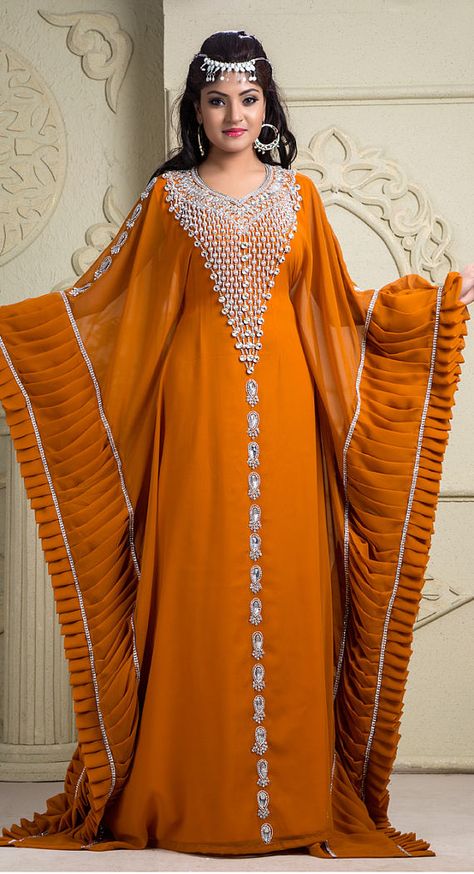 Premium Kaftan FABRIC Crepe, Silk, Georgette COLOR Orange WORK Sequins, Stones, Other TYPE: Kaftan SLEEVE LENGTH Elbow Sleeves 6-12 NECK STYLE Round Neck Fully lined Comes with waist tie for a more flattering fit Care: Dry Clean Only Fabric color shown in the picture could be slightly Types Of Women Dresses, Ramadan Abaya, Dubai Party, Party Wear Long Gowns, Arabic Kaftan, Arabian Dress, Festival Mode, Arabic Dress, Moroccan Kaftan