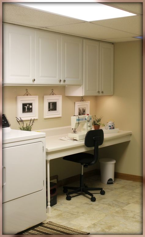 My Sewing area in laundry room/ spools of thread photography below cupboards, looked to be hung by by small wire hangers found in craft shop/undercounter lighting Half Laundry Half Office, Office Laundry Room Combo Small Spaces, Sewing Laundry Room, Laundry Room With Sewing Area, Laundry Sewing Room Combo, Laundry Craft Room Combo, Desk In Laundry Room, Laundry Room With Desk, Small Home Office Storage