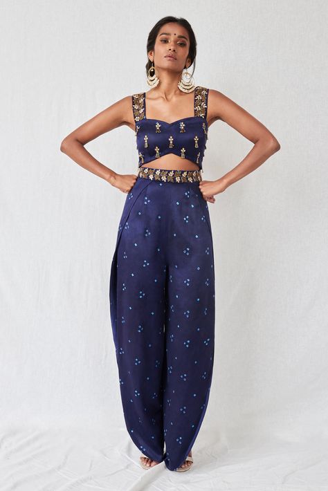 Bandhani jumpsuit in midnight blue with a princess neckline with sequin and tassel embroidery all over the bust and cut-dana and stone embroidery on the straps and waist. The top has a cut-out detail at the waist and the pants are wrap-around style with openings at the sides Desi Jumpsuit, Crop Top Ideas, Ladies Crop Top, Tassel Embroidery, Goa Wedding, Stone Embroidery, Trendy Outfits Indian, Mehendi Outfits, Tandoori Masala