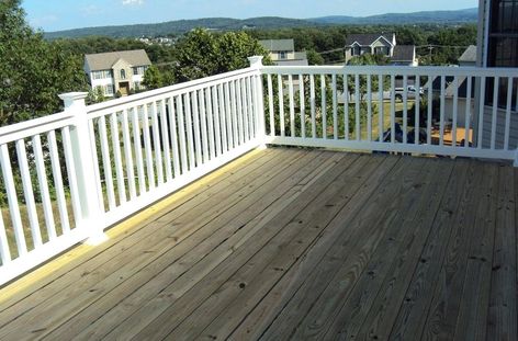 Pressure treated deck with white railing Unique Deck Railing Ideas, Vinyl Deck Railing, Wood Deck Designs, Wood Deck Railing, Aluminum Railing Deck, Deck Railing Ideas, Railing Designs, Vinyl Deck, Deck Railing Design