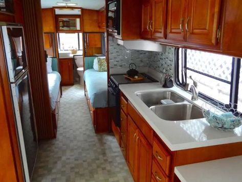 Check out the sheer beauty inside this backyard Avion: The wooden cabinetry is stunning Avion Camper Remodel Interior Design, Avion Remodel Interiors, Dark Wood Camper Interior, Bambi Airstream Remodel, Avion Camper, 1970 Airstream Remodel, Avion Trailer, Airstream Sovereign Remodel, Small Travel Trailer Remodel