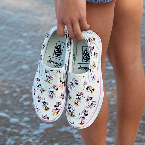 Vans and Disney come together for a magical collaboration that reimagines some of the most beloved and iconic animated characters. Dedicated to those who are young at heart, the Minnie Disney Slip-On combines the iconic Vans low profile slip-on with a custom allover print of Minnie Mouse. The Disney Slip-On also features sturdy canvas uppers with elastic side accents, padded collar and heel counters, signature waffle rubber outsoles. Cute Vans, Disney Vans, Disney Shoes, Women's Slip On Shoes, Disney Clothes, Vans Sneakers, Leather Shoes Woman, Sneakers Outfit, Classic Shoes