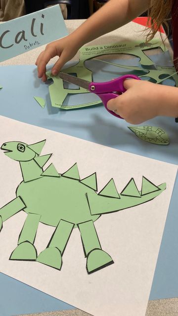 Tracy Boberg Nichols on Instagram: "Starting the year with building a Dinosaur 🦕 using geometric shapes with my 1st graders. Then they do a crayon rocking on the back.  What 1st graders doesn’t love dinosaurs?  The template is in my TPT ship - see link in my bio. It’s called Build a Dinosaur. . .  .  . #1stgradeart #kidsart #kidsartclass #kidsactivityideas #kidscraftideas ##artprojects #artlessonsforkids #artlessons #homeschoolart #artteachersofinstagram #kidsartclass #artcurriculum #homeschoolart #homeschoolartclass #elementaryart #artteachersofinstagram #elementaryartteacher #primaryart #primaryartteacher #primaryartclass #artteachersofig #artteacher #artteacher #artteachers  #tracynicholsart1stgrade" Dinosaur School Theme, Build A Dinosaur, Library Activities, Interactive Display, School Theme, Kids Art Class, Art Lessons For Kids, Art Curriculum, Homeschool Art