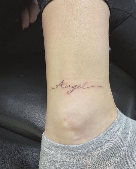 Tattoo that says "angel" located on the ankle, done Sean From Texas, Community Tattoo, International Tattoo, Small Neck Tattoos, Neck Tattoos, Angel Tattoo, Tattoos Gallery, Word Tattoos, Neck Tattoo