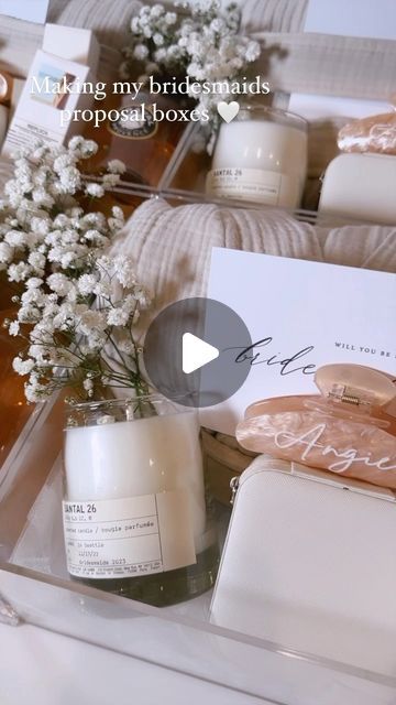 iluvsarahii on Instagram: "Packing my bridesmaids proposal boxes 🤍 I filled them in with things that I love that I know they will truly love as well. 

@parachutehome Cloud Quilt Robe
@miraval Rose 
@lelabofragrances Santal 33 Candle 
@luxunfiltered N24 Hand Cream 
@summerfridays Lip Balm 
@maisonmargielafragrances Replica Beach walk fragrance 
@ginnecarow Jewelry +  Jewelry Case 
@cb2 Martini Glasses 
Custom boxes, hair clips and cards from @etsy" Miraval Rose, Quilt Robe, Bridal Proposal Box Ideas, Bridesmaid Proposal Box Ideas, Bridesmaids Proposal Boxes, Replica Beach Walk, Cloud Quilt, Bridesmaids Proposal, Proposal Boxes