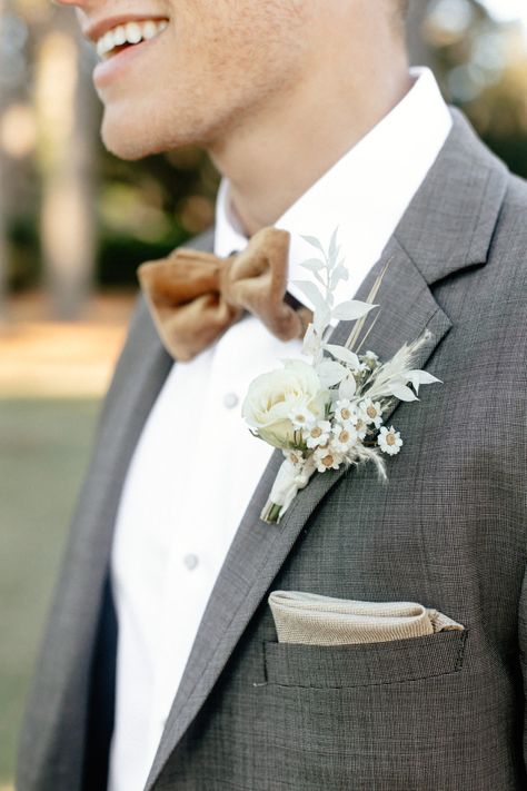 A charcoal suit jacket and trousers accessorized with a mustard velvet bow tie. Photo: Dash Photography Marsh Wedding, South Carolina Elopement, Groom Attire Black, South Carolina Lowcountry, Groom And Groomsmen Suits, Groomsmen Grey, Courtyard Wedding, Charcoal Suit, Velvet Bow Tie