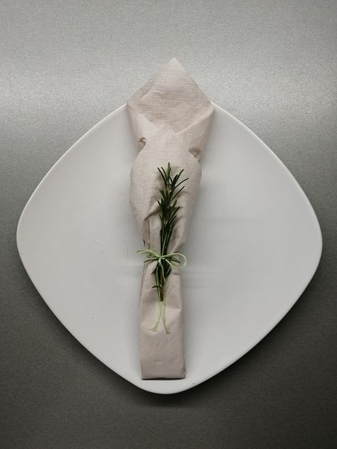 Paper napkin with  rosemary. Paper Napkins Table Setting, Christmas Napkin Folding Paper, Paper Napkin Folding Ideas Christmas, Napkin Folding Ideas Paper, Paper Napkin Folding Ideas, Napkin Folding Ideas, Christmas Napkin Folding, Paper Napkin Folding, Christmas Cutlery