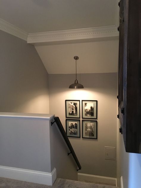 Beautiful Homes of Instagram -The grey wall paint color is Metro Gray by Benjamin Moore. Corner Stairs Decor, Stair Corner Decor, Top Of Stairs Decor Upstairs Landing, Top Of Stairs Decor, Grey Wall Paint, Stair Landing Decor, Stair Wall Decor, Landing Decor, Wall Paint Color