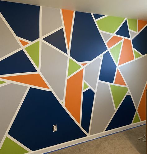 Boys accent wall idea Diy Geometric Wall Paint Bedrooms, Geometric Accent Wall Paint, Big Kid Room Boy Bedrooms, Geometric Painted Accent Wall, Kids Room Accent Wall Boy, Modern Geometric Wall Paint, Boys Bedroom Accent Wall Ideas, Playroom Accent Wall Ideas Paint, Boy Room Accent Wall Ideas