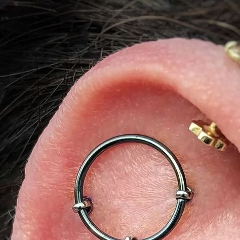 Diamond Heart Studios on Instagram: "Want piercings that stand out? @bryanjpiercing specializes in unique ear projects and is available today for appointments and walk-ins! Book online or call the front desk! Here's another mysterious "Floating Ring" industrial with a genuine diamond charm 💎 

#floating #industrialpiercings #earproject #bodypiercing #diamondjewelry #earrings #uniquepiercings #bodyjewelry" Ring Industrial, Floating Ring, Industrial Piercing, Piercings Unique, Diamond Charm, Diamond Heart, Front Desk, Books Online, Body Jewelry