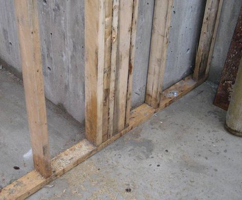 stud-wall-framed-at-concrete-wall-over-concrete-slab Concrete Floor Wood Wall, How To Build A Stud Wall Diy, Stud Wall Construction, Building A Stud Wall On Concrete, Building A Stud Wall, Concrete Wall Section Detail, Building Extension, Framing Construction, Extension Designs