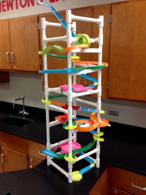 Paper Roller Coaster using 1/2" PVC for structure.  Pipe was cut so beams and columns can be attached.  Total project was $300 for up to 50 groups. Less than $50 every year after. Paper Roller Coaster Project, Diy Roller Coaster, Crafts Using Cardboard, Roller Coaster Project, Roller Coaster Design, Paper Roller Coaster, Beams And Columns, Cardboard Coasters, Marble Tracks