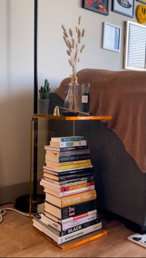 Retro Side Table Living Room, Side Tables Bedroom Decor Aesthetic, Bedside Table Books Aesthetic, Stacked Books As Side Table, Books Side Table, Acrylic Side Table Living Room, Book Stack Side Table, Stack Of Books Bedroom, Book Stack Nightstand