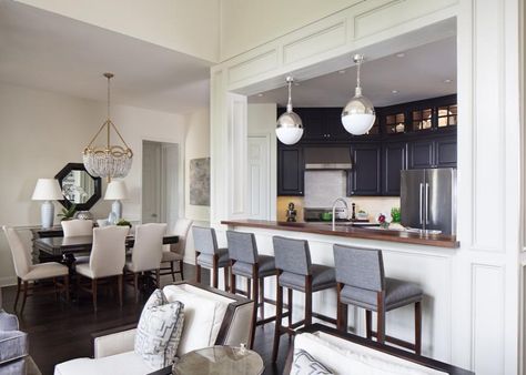 Instead of a complete open plan design, this kitchen features a large pass-through window. The dark blue cabinets are a refreshing surprise and contrast to the home's many white elements and help the small kitchen feel both sophisticated and intimate. Pass Through Kitchen To Living Room, Small Transitional Kitchen, Pass Through Kitchen, Kitchen Pass Through, Kitchen Pass, Pass Through Window, Table Ikea, Decor Ikea, Black Kitchen Cabinets