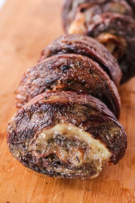 Get ready to show off your cooking skills with this Stuffed Flank Steak that is tender, juicy, and bursting with cheese, garlic, and herbs. #steak #grilled #grilling #flanksteak #grilledflanksteak #grilledstuffedflanksteak #stuffedflanksteak #beefflanksteak #recipe #numstheword #summergrilling Stuffed Steak Rolls, Grilled Stuffed Flank Steak, Flank Steak Rolls, Steak Roll Ups, Steak Pinwheels, Stuffed Flank Steak, Steak Grilled, Top Round Steak, Round Steak Recipes