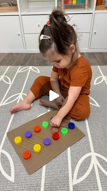 Desiree Blanchard, M.H.K | Baby & Toddler Play on Instagram: "❤️🌈Easy DIY activities for your toddlers !! Click the ✨FOLLOW✨ button to continue learning more!   Activities in order of reel: 💟 wooden spoon and lacing with hair elastics  💟sock puzzle - hide the puzzle pieces in socks!  💟plastic caps with elastics - you can encourage colour matching or have your little one put the elastic on two caps  💟popsicle stick matching 💟hair elastic transferring - you can use a fork, stick or end of a comb!    Let me know if you have any questions in the comments!! ⬇️  ➡️Don’t forget to check my “Activities and Milestones Caregiver Guides” - link in bio! ✨  👶🏻👶🏽👶🏾Activities are recommended for approximately 18mts +. Supervision is always required.   • • •  #momssupportingmoms #newmomsupport Buttoning Activities For Kids, Buttoning Activities, Kindergarten Sensory, Craft Games, Tactile Activities, Islamic Kids Activities, Abstract Art Diy, Hair Elastic, Colour Matching