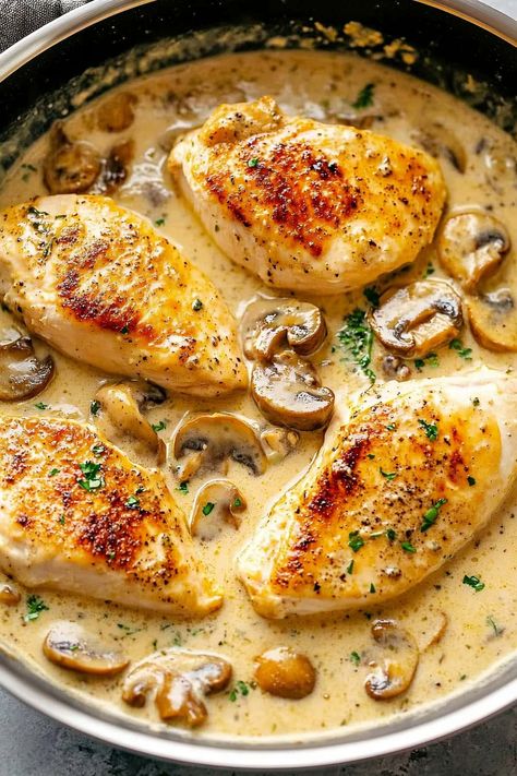 This Creamy Chicken Diane recipe features tender chicken breasts in a luscious cream sauce with mushrooms, shallots, garlic, Dijon, and a splash of brandy. Serve it with egg noodles to soak up the delicious sauce. Creamy Chicken Diane, Chicken With Creamy Sauce, Chicken With Cream Of Chicken Recipes, Chicken In Basil Cream Sauce, Chicken Dijon Cream Sauce, Keto Entree Recipes, Chicken Creamy Recipes, Thanksgiving Recipes Chicken, Chicken Angelo