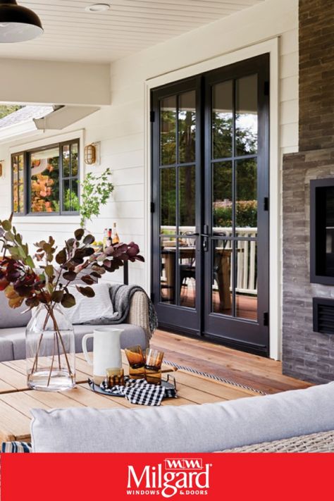 Black French patio doors add an dark elegance to this farmhouse patio. Featuring Ultra™ Series Patio Doors. #patiodoorideas #frenchpatiodoors #patiodoormakeover Back Door French Doors Patio, Black French Doors To Deck, Bedroom Patio Doors Master, Bedroom Door To Patio, French Door Kitchen To Patio, Backyard Doors Ideas Patio, French Door Ideas Exterior, Backyard Sliding Doors, Bedroom With French Doors To Patio