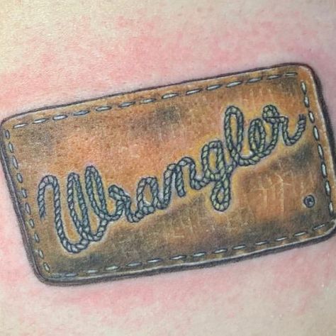 Club Tattoo Miracle Mile Shops on Instagram: “Cowboy up!! Realistic @wrangler jeans tag done by @clubtattoolasvegas resident tattoo artist @sandyai4  Is there a brand or logo that…” Cow Ear Tag Tattoo, Cattle Tag Tattoo, Wrangler Patch Tattoo, Brand Tattoo Cowboy, Western Minimalist Tattoo, Southern Tattoos Men, Wrangler Tattoo, Men’s Western Tattoos, Cow Tag Tattoo