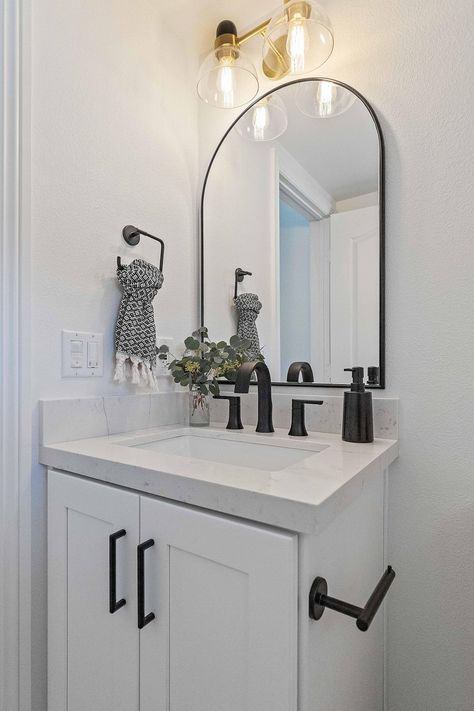 Minimalist Half Bath, White Vanity Powder Room, Small Half Bath Decor, Tiny Modern Bathroom, White Bathroom With Black Accents, Bathroom With Shower Only, Modern Powder Bathroom, Airbnb Plans, Small Half Bathroom Remodel