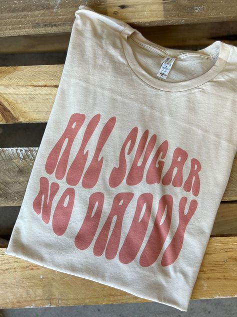 "All Sugar No Daddy" Graphic Tee Cream & White Colors Super Soft & Stretchy Cotton Tee Unisex Cut ~ Runs Roomy ~ If You Want A More Fitted Tee We Recommend You Size Down Women's Sizing Recommendations Small 0/2/4 Medium 4/6/8 Large 8/10/12 XL 12/14/16 2XL 16/18/20 3XL 20/22/24 ***These Are PRINTED/MADE TO ORDER! Please Allow 7-10 Business Days To Ship. If You Order Multiple Items, These Will Be Shipping Out SEPARATELY From Your Order. Graphic Tee Sayings, Graphic Tees Preppy, Fun Tshirt Designs, Cricut Tee Shirt Ideas, Cricket Shirt Ideas, Graphic Tee Ideas, Medical Shirts, Small Business Shirt, Cut Shirt Designs