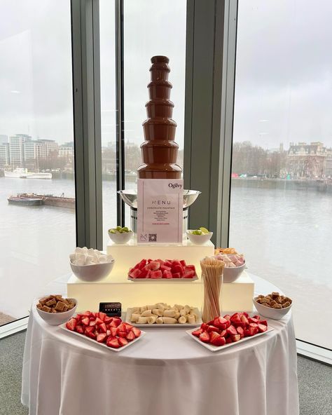 Turning rainy days into chocolatey delights! 🌧️🍫 We had a blast serving up our chocolate fountain at @ogilvyuk event yesterday! . . . Discover our chocolate fountain service: Indulge in our 7-tier chocolate fountain, complete with a selection of unlimited fruit, pastries and baked dippers of your choosing. Our dedicated uniformed attendants keep the servings flowing, ensuring your guests never go without. . 📆Book via link in bio . . . . . #chocolatefountainlondon #ogilvyuk Chocolate Fountain Buffet, Wedding Chocolate Fountain Display, Chocolate Fountain Wedding Ideas, Chocolate Fountain Dippers, Chocolate Fountain Bar Ideas, Chocolate Fountain Ideas, Hi Tea Ideas, Casino Gala, Chocolate Fountain Wedding