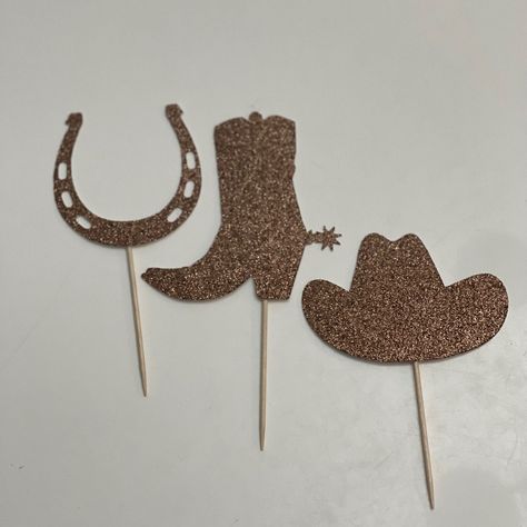 "Our cupcake toppers are handcrafted using a combination of 65 lb. and 110 lb. card stock PAPER Description: ~Size of hat is 3\" w x 2\" h, boot is 3\" w x 3\" h, horseshoe is 3\" w x 3\" h ~One sided toppers- food pick exposed on back ~Attached to a wooden 2.5\" tall toothpick ~One set includes 12 cupcake toppers - 4 of each style if you need all toppers in one color, please send us a note with your purchase that you want all blue or all pink Shipping: ~All items are shipped via USPS first clas Crab Cupcakes, Ocean Cupcakes, Cowboy Cupcakes, Wolf Cake, Shoe Cupcakes, Fishing Cupcakes, Cowboy Birthday Party, Cowboy Birthday, All Pink