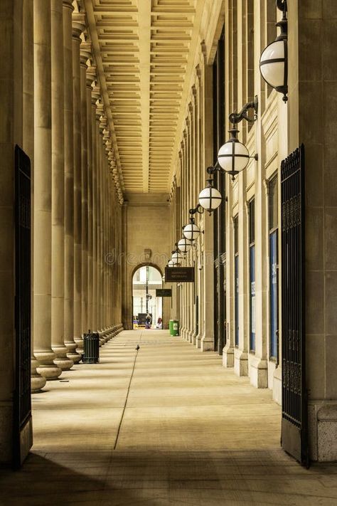 A footpath at Chicago Union Station with tall stone pillars, a man walking, round lights and black metal gate in downtown Chicago royalty free stock Black Metal Gate, Chicago Union Station, Metal Gate, Stone Pillars, Vector Poster, Round Light, Downtown Chicago, Union Station, Windy City