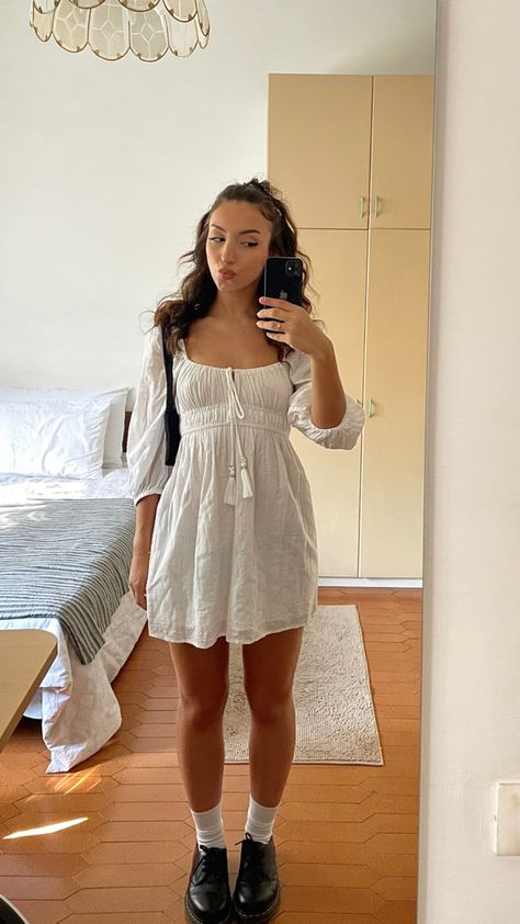 White dress + Dr Martens 🫠 White Dress Date Outfit, White Dr Martens Dress, White Dress And Doc Martens, Dress With Dr Martens Outfit, White Dr Martens Outfit Fall, Laufey Concert Outfit Ideas, Laufey Goddess, Dr Martens Outfit Fall, White Dr Martens Outfit