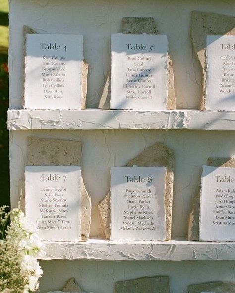 Beautiful and Creative Seating Charts Ideas Neutral Seating Chart, Travertine Signage, Stone Seating Chart, Stone Table Numbers Wedding, Seat Assignment Wedding Ideas, Creative Wedding Seating Chart, Modern Wedding Signage, Unique Wedding Details, Creative Seating