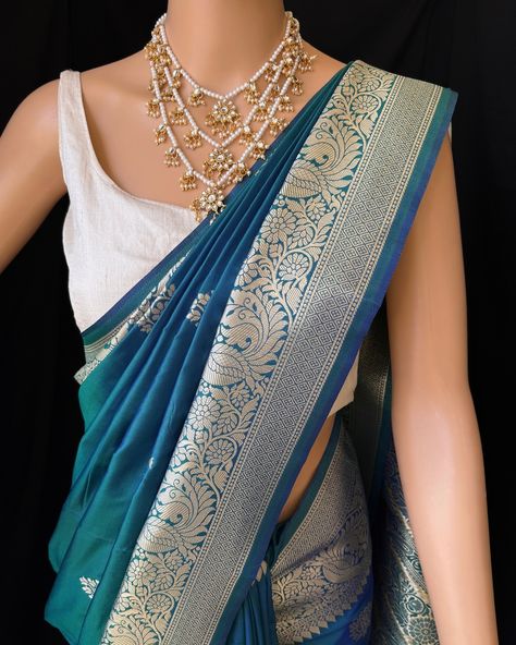 Peacock blue Art silk saree with contrast golden zari border and design all over saree. Comes with running blouse. Find this saree in our website: Www.thejacouture.in > silk sarees> peacock blue art silk saree. #silksarees #peacockbluesaree #artsilk #sareeslove #silk Blue Saree, Art Silk Sarees, Peacock Blue, Blue Art, Silk Saree, Silk Sarees, Saree, Silk, Running