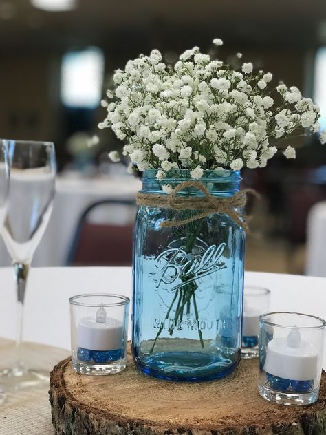 Blue Mason Jars Centerpiece, Light Blue Mason Jar Centerpieces, Rustic Blue Table Decor, Tea Light Mason Jar Centerpiece, Simple Wedding Table Decor Reception Ideas Mason Jars, Blue Mason Jar Wedding, Wedding Centerpieces Light Blue, Blue Ball Jar Centerpieces, Blue Jar Centerpiece