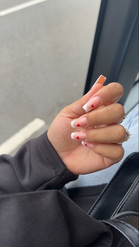 Valentine Nails Designs Square, Nail Inspo Valentines Day Square, Valentines Nails White French Tip, Nail Inspo Red Heart, French Red Heart Nails, Pink French With Red Heart, White French Nails With Red Heart, Heart French Tip Nails Square, White Red French Nails