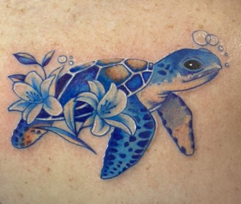 Turtle Tattoo With Name, Mother Earth Tattoos For Women, Dolphin Turtle Tattoo, Small Watercolor Sea Turtle Tattoo, Sea Turtle Tattoo For Women Sleeve, Plumeria And Turtle Tattoo, Sea Turtle Plumeria Tattoo, Blue Cover Up Tattoo, Sea Turtle Tattoo Designs For Women