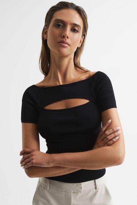 Embrace a new rendition of a staple top, the Esme is crafted in a ribbed arrangement with stretch elements for all-day comfort. The defining features are the off-shoulder silhouette and cut-out detailing to the chest, elevating this piece to work for daytime and evening edits alike. Wear with tapered trousers and add a blazer for a simple yet bold ensemble. Add heels for impact. Off-shoulder neckline Short sleeves. Cut-out detail. Fitted Staple Tops, Fitted Jumper, Tapered Trousers, Cut Out Top, Boat Neckline, Off Shoulder Tops, Jumpers For Women, Knitwear Women, Boat Neck