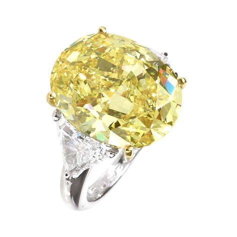 Moussaieff oval cut 14.23ct Natural Fancy Intense Yellow diamond flanked by 1.84ct trillion diamonds and mounted in platinum. Fancy Yellow Diamond Ring, Big Engagement Rings, Yellow Diamond Ring, Yellow Diamonds Engagement, Cushion Cut Diamond Ring, Yellow Diamond Engagement Ring, Yellow Sapphire Rings, Sapphire Engagement Rings, Oval Diamond Ring