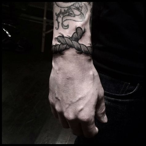 Tattoo done by Amalie. Around Wrist Tattoo, Anchor Tattoo Wrist, Rope Tattoo, Navy Tattoos, Wrist Bracelet Tattoo, Black Men Tattoos, Meaningful Wrist Tattoos, Tattoo Man, Bird Tattoo Wrist