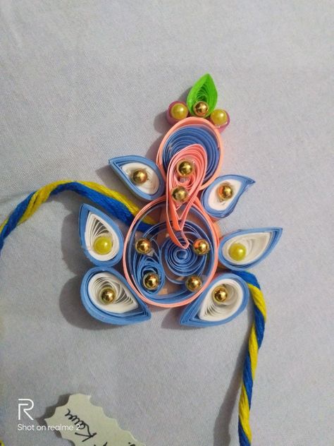 Ganesha ji Handmade rakhi Quilling Rakhi Handmade, Quilling Rakhi, Mandala Motifs, Handmade Rakhi, Book Crafts Diy, Hand Embroidery Projects, Quilling Designs, Quilling Art, Beaded Rings