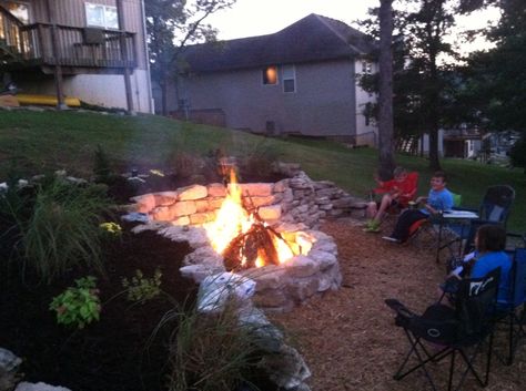 Built a fire pit into the hillside using natural rock. Hillside Fire Pit, Fire Pit Desserts, Fire Pit Grate, Portable Fire Pit, Outside Fire Pits, How To Build A Fire Pit, Fire Pit Ideas, Fire Pit Chairs, Outdoor Fire Pit Designs