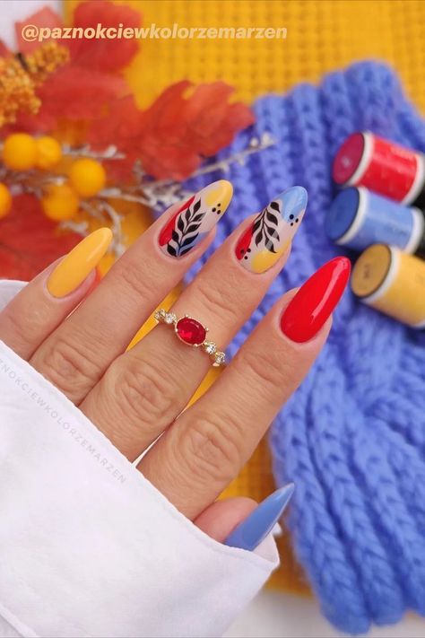 Yellow Red Blue Fall Nails with Leaf Nail Art Check more at https://mangadexx.com/yellow-red-blue-fall-nails-with-leaf-nail-art/ Red Blue Yellow Nails, Fall Nails With Leaf, Yellow And Red Nails, Blue Fall Nails, Leaf Nail Art, Yellow Nail Art, Red Nail Polish, Red Nail Designs, Blue Nail Designs