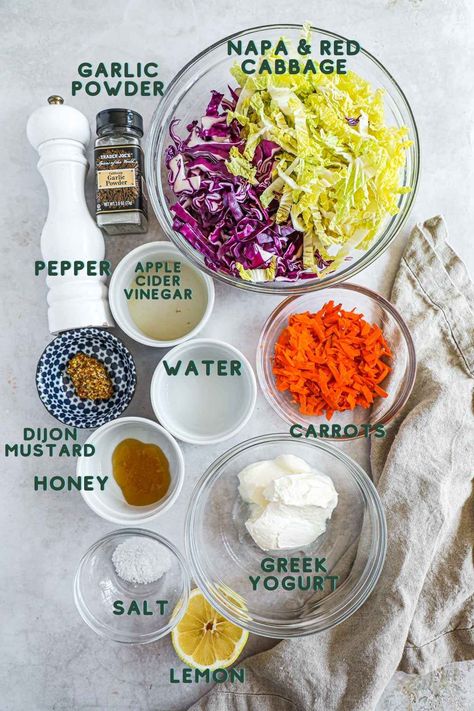 Greek Yogurt Coleslaw features crisp shredded cabbage and carrots dressed in tangy Greek yogurt dressing. This healthy coleslaw recipe is the perfect addition to pulled chicken sliders or side for your next BBQ! We love coleslaw but find that the standard dressing can be a little heavy. In order to make the dressing healthier and lighter, we use a Greek yogurt base instead of traditional mayonnaise, honey, and apple cider vinegar for tang. It's a delicious salad rich in probiotics! Coleslaw Recipe Greek Yogurt, Greek Yogurt Coleslaw, Yogurt Coleslaw, Crunchy Coleslaw, Healthy Coleslaw Recipes, Bbq Pulled Chicken, Cabbage And Carrots, Healthy Coleslaw, Greek Yogurt Dressing