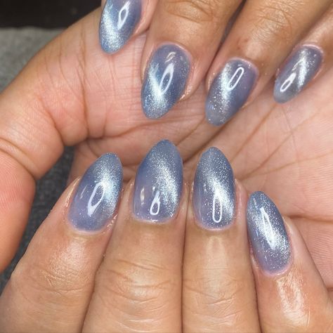 Cat eye adds such a fun flair to you nails! Ask about it at your next appointment! #manicure #nailsnailsnails #nailstagram #nailsonfleek @nikki.brushed.nail.salon Blue Grey Cat Eye Nails, Baby Blue Cat Eye Nails, Light Blue Cat Eye Nails, Cateyes Nails Design, Blue Cat Eye Nails, Cats Eye Nails, Jersey Nails, You Nails, Blue Cat Eye