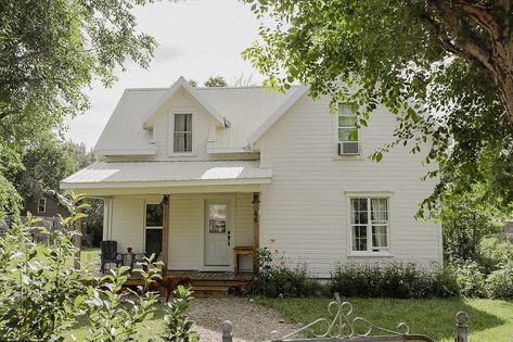 We bought the house two years ago come August, had three weeks to renovate and move in, and have been working on her ever since. The front door was a spare Pop had from a job, the porch was built from leftover deck materials that were warped. The stone path was made by foraging down by the river and loading stones back and forth with Ma and the kids. The lawn was a dirt pit and took hours upon hours of raking, sifting, adding new dirt, seeding, adding more dirt, and patience. The upstairs sin... Coming Home Aesthetic, Farmhouse In The Woods, Old Farmhouse Exterior, Cottage Farmhouse Exterior, Farmhouse Exterior Paint Colors, Dream Farmhouse, Prairie Home, Small Farmhouse, Stone Path