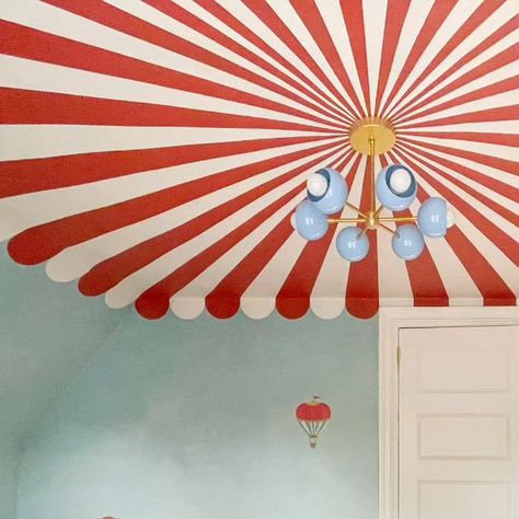 Sazerac Stitches on Instagram: "This circus themed nursery took a challenging ceiling shape and really made the most of it in the best way. We loved how Mom not only designed this room and painted the ceiling, but she also used our Loa Carousel to bring the tent to a center point. Hats off to mom! #sazeracstitches #nurserydesign #muralceiling #nurserymural #unisexnursery #maximalistinteriors #modernlighting" Circus Tent Ceiling, Circus Room, Girls Room Paint, Painted Trim, Toddler Girl Room, Nursery Mural, Unisex Nursery, Sazerac, Circus Tent