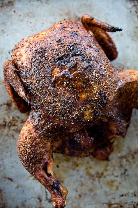 Easy Smoked Chicken is a great summer meal. The chicken turns out incredibly flavorful, tender and juicy. Perfect for BBQs or any time you want to cook a whole chicken but want to do something a little different than traditional roasting. Whole Smoked Chicken, Roaster Chicken, Cook A Whole Chicken, Smoked Chicken Recipes, Smoked Whole Chicken, Traeger Grill Recipes, Beer Can Chicken, Whole Chicken Recipes, Pellet Grill Recipes