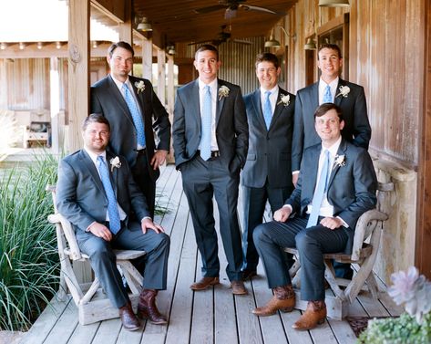 The gentlemen wore gray suits with brown cowboy boots, but the groom gave them ties to represent their personalities. They wore hydrangeas wrapped in twine as boutonnieres to retain the rustic theme. Suit With Cowboy Boots, Gray Groomsmen, Gray Groomsmen Suits, Cowgirl Boots Wedding, Wedding Cowboy Boots, Gray Suits, Cowboy Boot Outfits, Groomsmen Grey, Wedding Tux