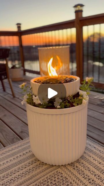 Amanda Albrecht Illinois Realtor + Content Creator on Instagram: "Here’s a step-by-step tutorial on how I turned my planter into a fire bowl. This only takes 5 to 10 minutes and is a DIY anyone can do.  Using the viral $30 planter and filling it with a bucket. Adding dirt and then a smaller fluted planter on top.  Fill the smaller planter with lava rock, which is a non-flammable base. Use a tabletop fire kit and deconstruct. It will come with a stainless bowl where you can place your fuel source and a glass hurricane.  Hold both of those items in place with fire Glass. It wouldn’t be a planter without plants so adding some easy to take care of flowers full disclosure I don’t have a green thumb and these may not make it through the season but we’re gonna try.  Fuel source, I prefer rubbing Fire Bowls Around Pool, Round Fire Table, Diy Planter Fire Bowl, Planter Fire Pit Diy, Diy Fire Pots By Pool, Diy Citronella Fire Bowl, Diy Giant Planter, Diy Fire Bowl Patio, Fire Bowls Outdoor Diy