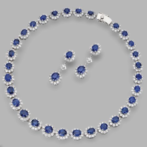 "18 Karat White Gold, Sapphire and Diamond Necklace and Pendant-Earrings The slightly graduated necklace set with oval sapphires weighing approximately 41.50 carats, framed by round diamonds weighing approximately 20.50 carats, length 15¾ inches; the earrings set with oval sapphires weighing approximately 7.40 carats, framed and spaced by round and baguette diamonds weighing approximately 4.50 carats--two AGL report--the sapphires are of Burmese origin,no gemological evidence of heat" ©Sotheby's Saphire Jewelry, Jewellery Design Gold, Convertible Jewelry, Latest Gold Jewellery, Guitar Patterns, Blue Sapphire Jewelry, Graduation Necklace, Jewelry Set Design, Confident Women